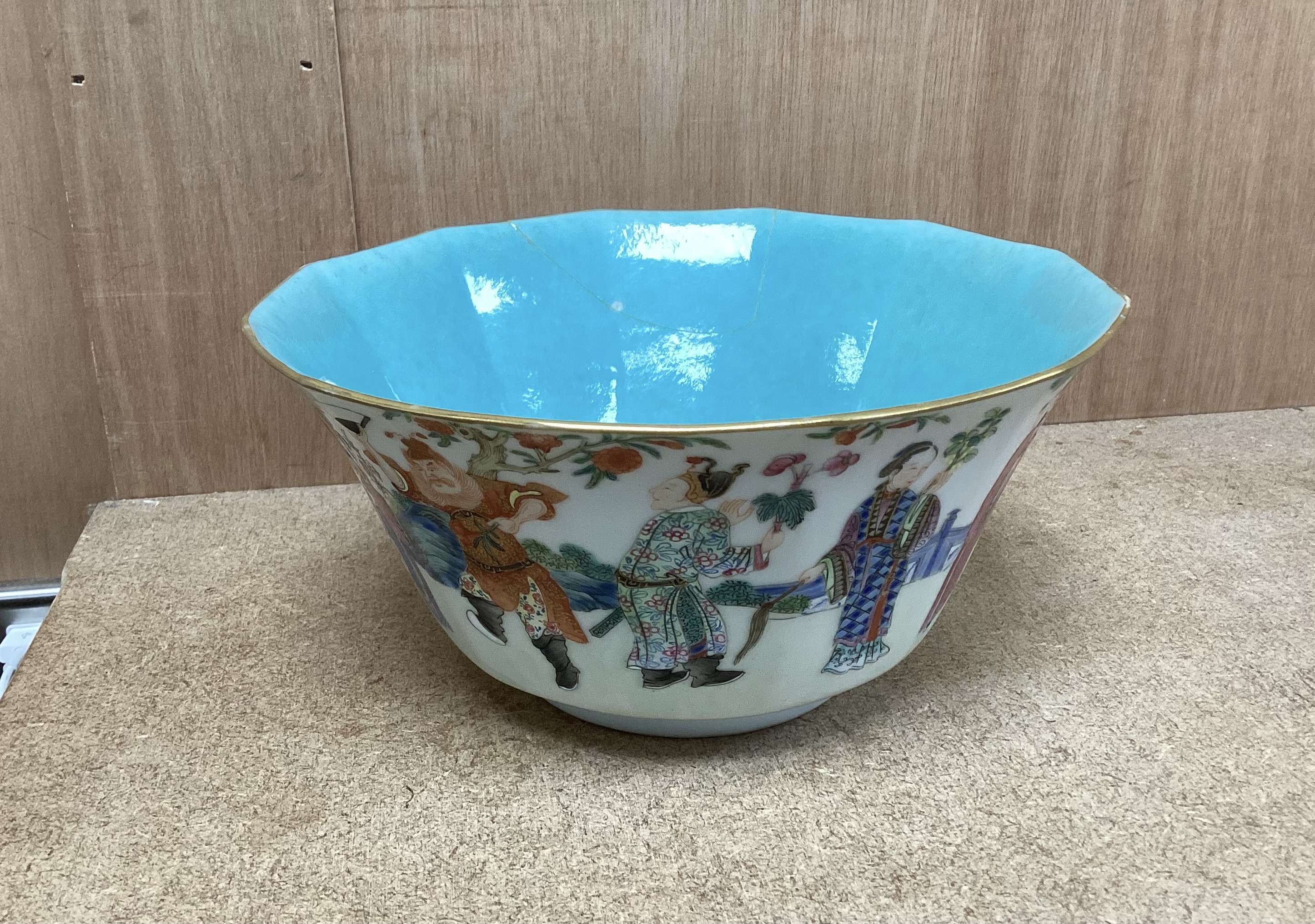 A Chinese famille rose bowl, Daoguang seal mark and of the period (1821-50), painted with famous historical and mythical figures, 18cm diameter (a.f.)